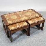 A 1970's nest of three tile top occasional tables,