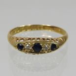An 18 carat gold sapphire and diamond boat shaped ring