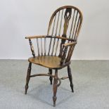 A 19th century elm windsor armchair