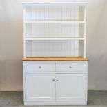 A light oak and cream painted dresser,