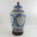 WITHDRAWN - A Chinese porcelain vase and cover on stand,