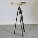 A reproduction brass telescope, on stand,