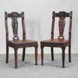 A set of four Arts and Crafts period walnut dining chairs,