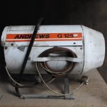 An Andrews space heater, together with two wooden stepladders,