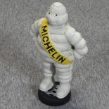 A painted cast iron model of the Michelin man,