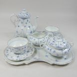 A late 19th century Bing and Grondahl porcelain blue and white tete a tete, on a cabaret tray,