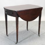 A George III mahogany pembroke table, on square legs,