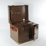 A brown leather champagne hamper, with a fitted interior,