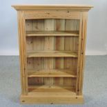 A modern pine open bookcase,