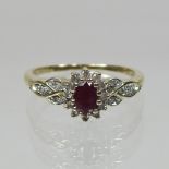 A 9 carat gold ruby and diamond cluster ring,