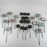 A set of twenty four cast iron herb and vegetable markers