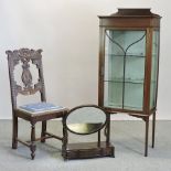 An Edwardian carved oak hall chair,