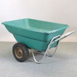 A green garden wheelbarrow