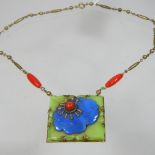 An Art Deco necklace, with a carved hardstone pendant, 4cm wide, in the style of Max Neiger,