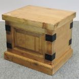 A small handmade pine box, with a hinged lid,