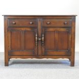 An Ercol dark elm sideboard,