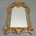 A Rococo style gilt framed wall mirror,