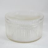 A circular glass cake box,