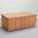 A pine box, with a hinged lid,