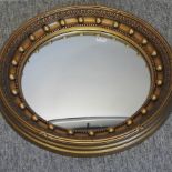 A Regency style gilt framed convex wall mirror,