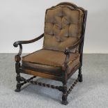 A 1920's oak and cane armchair,