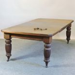 A Victorian walnut extending dining table, with two additional leaves, 234 x 116cm overall,