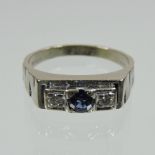 An 18 carat white gold sapphire and diamond ring,