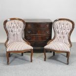 A pair of Victorian style nursing chairs, together with a reproduction mahogany bachelor's chest,