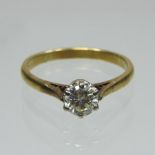 An 18 carat gold solitaire diamond ring