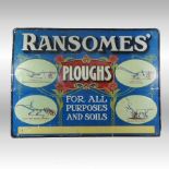 A vintage tin advertising sign, inscribed Ransomes Ploughs,