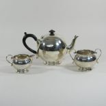 An early 20th century silver bullet shaped teapot, with an ebonised handle,