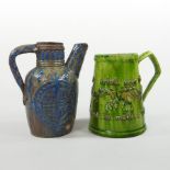 A Castle Hedingham green glazed pottery mug, inscribed with motto 'If you daily drink your fill,