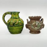 A Castle Hedingham green glazed pottery jug, decorated with horseshoes, 16cm high,