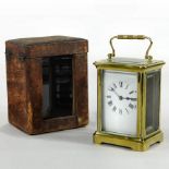 An early 20th century French brass cased carriage clock, the dial with Roman numerals, 12cm high,