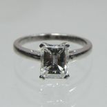 An 18ct gold single stone emerald cut diamond ring, approximately 1.