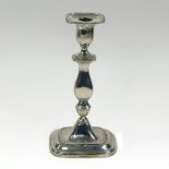 An early 20th century silver table candlestick, of knopped form, with beaded decoration,