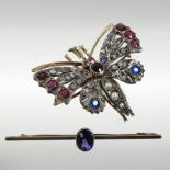 A Victorian unmarked butterfly brooch, set with rubies, diamonds, split pearls and sapphires,