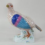 A Herend porcelain model of a partridge, printed marks and incised 5071 to base,