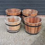 Two pairs of wooden garden pots,