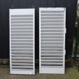 A pair of white painted wooden shutters,