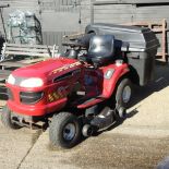 A HSUN red petrol driven ride on lawnmower,