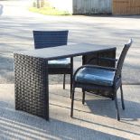 A brown rattan garden table, 122 x 59cm,