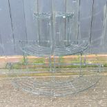 A pair of green painted iron graduated plant stands,