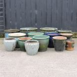 A collection of glazed garden pots,