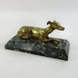 A brass model of a greyhound, on a marble base,