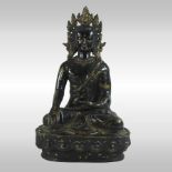 A Thai bronze and later painted figure of a seated deity,