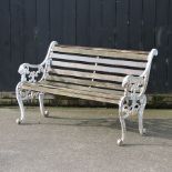 A cast iron and wooden slatted garden bench,