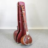 A 1960's Indian hardwood and inlaid sitar, 125cm high,