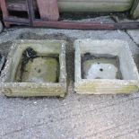 A pair of reconstituted stone garden planters,