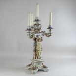 An early 20th century Dresden style porcelain figural candelabra,